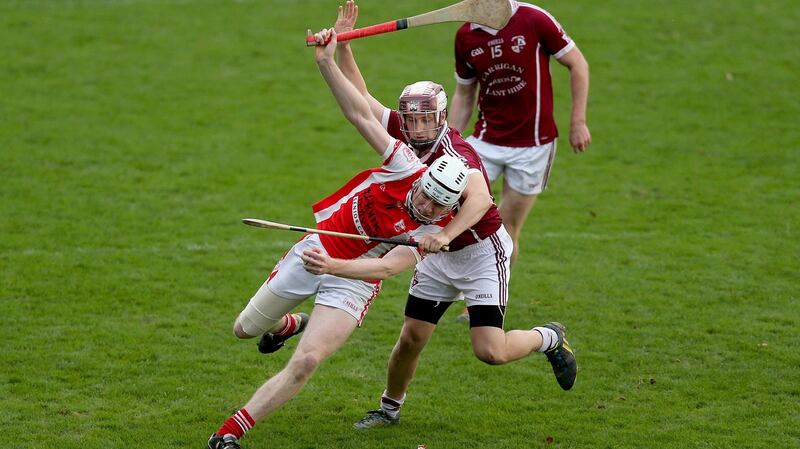 Colm Cronin of Cuala tussles with Tom Ryan of Clara during the Leinster club hurling semi-final in Parnell Park yesterday. Photograph: Donall Farmer/Inpho