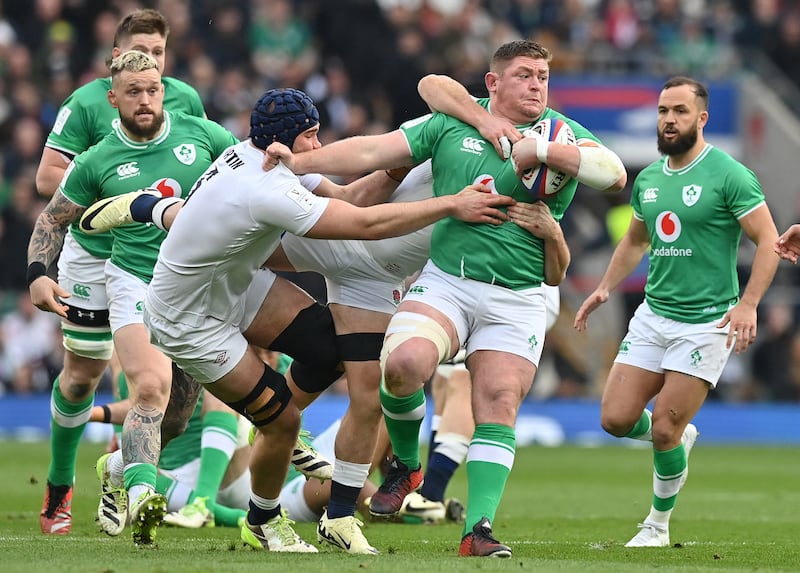 Tadhg Furlong of Ireland is tackled by George Martin of England at Twickenham on Saturday. Photograph: Glyn Kirk/AFP/Getty Images)