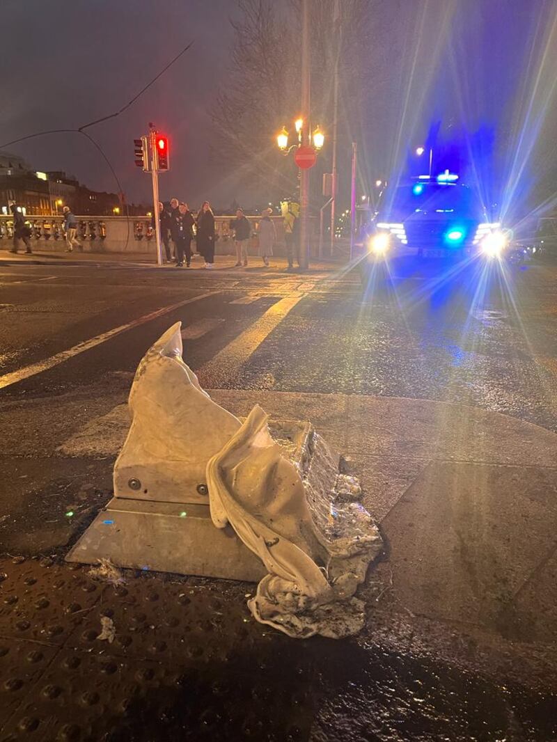 Burned out vehicles and a Luas in Dublin city centre on Friday morning after rioting in the capital on Thursday night. Photograph: Conor Pope