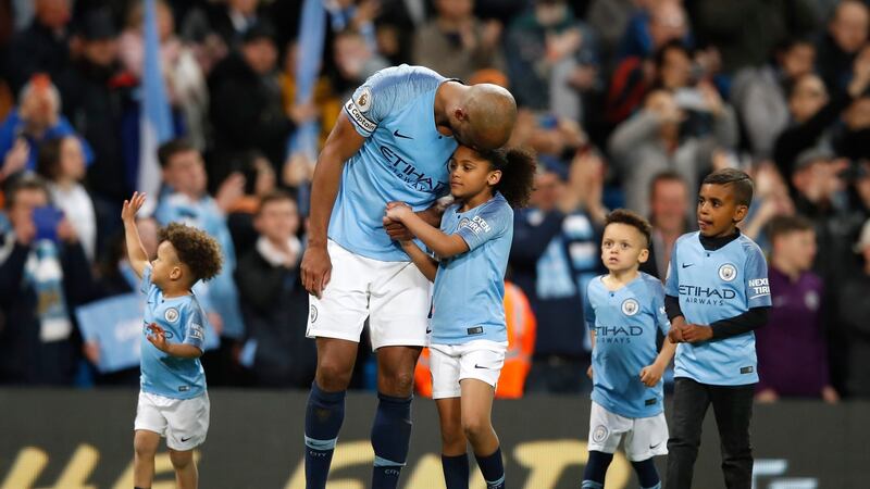 Vincent Kompany and his Mancunian wife, Carla, have three children. Photograph: Getty Images