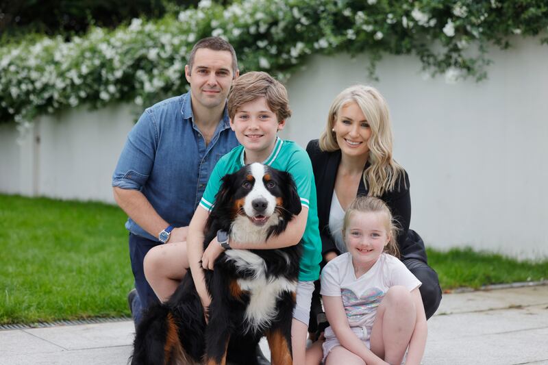 Jack Doyle (11), a primary pupil who has dyslexia, with sister Mary-Kate,  parents Ciarán Doyle and Catherine McKenna and and their dog Evie at home in Clontarf.  Photograph: Alan Betson