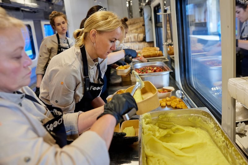 Cooks working on Ukraine's Food Train in Kharkiv station, from where thousands of meals each day are distributed to people displaced by Russia's invasion. Photograph: Courtesy of Ukrzaliznytsia