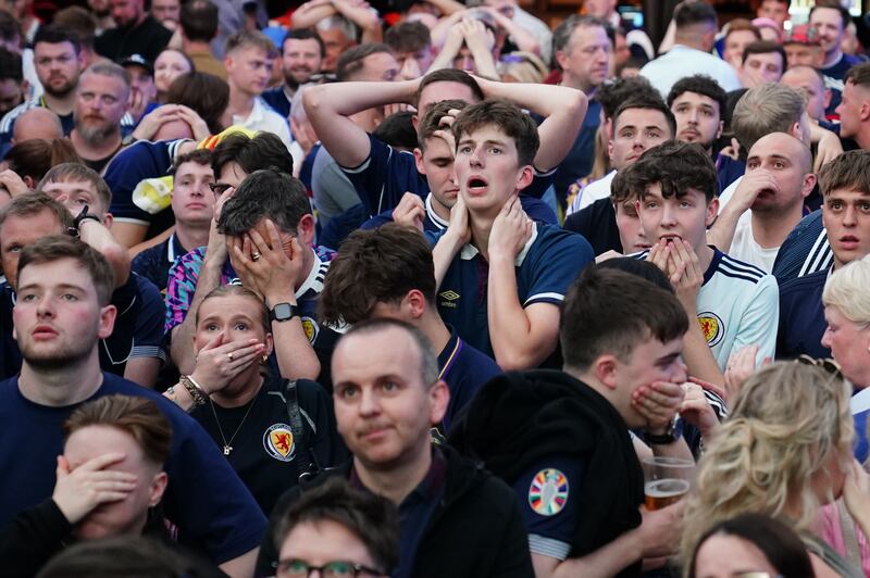 Scotland fans watching the game. Photograph: Jane Barlow/PA Wire