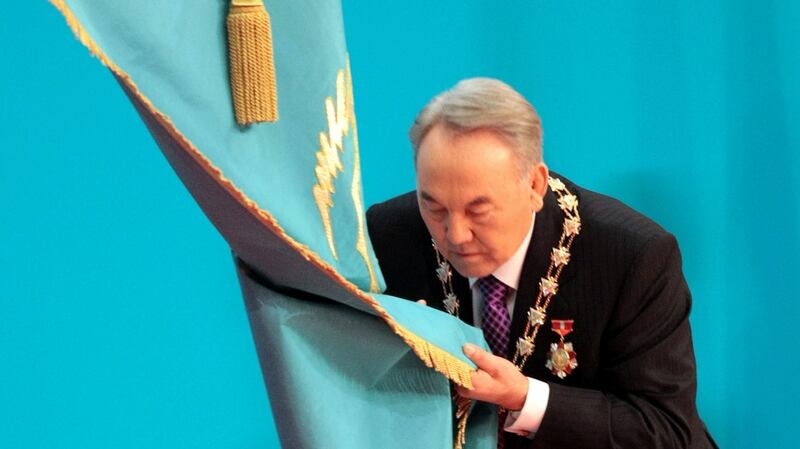 Kazakh president Nursultan Nazarbayev kisses the national flag during a swear-in ceremony in Astana. File photograph:  Alexey Filippov/AFP/Getty Images