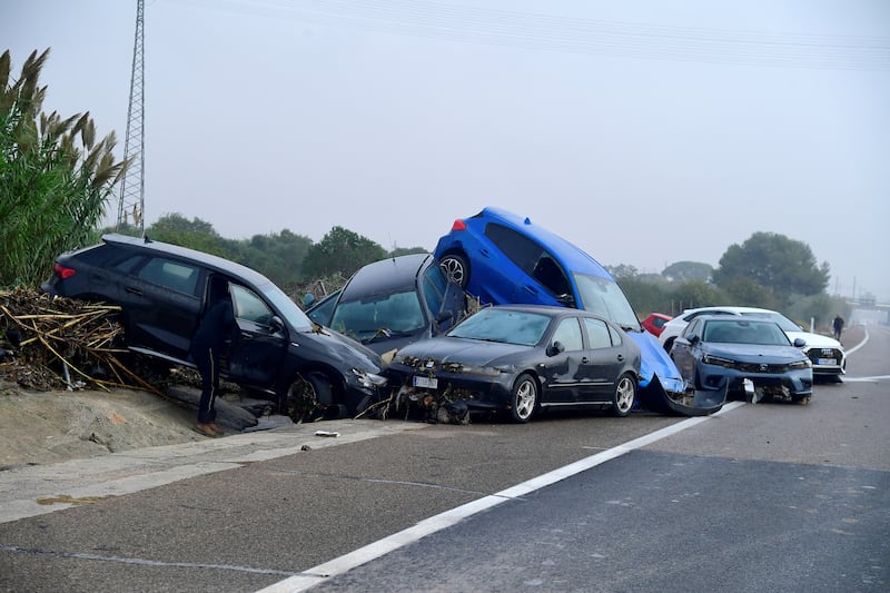 Cars piled up due to mudslides following floods in Picuana, near Valencia. Photograph:  Jose Jordan / AFP via Getty Images.