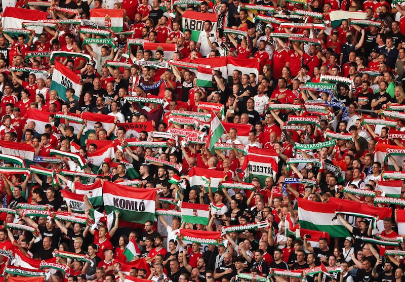 Fans of Hungary hold up flags and scarves during a Euro 2024 group stage match between Albania and Spain at Dusseldorf Arena in June. Photograph: Catherine Ivill/AMA/Getty Images