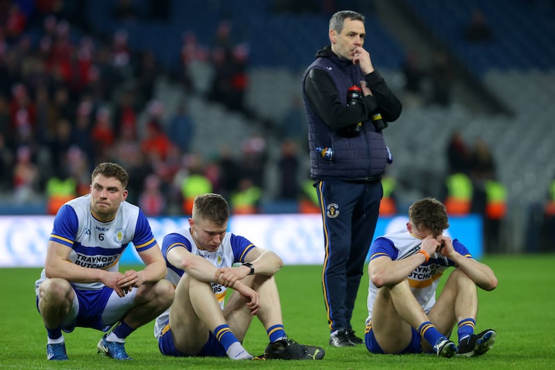 Errigan Ciarán's Niall Kelly, Ben McDonnell and Odhran Robinson after the game. Photograph: Bryan Keane/Inpho