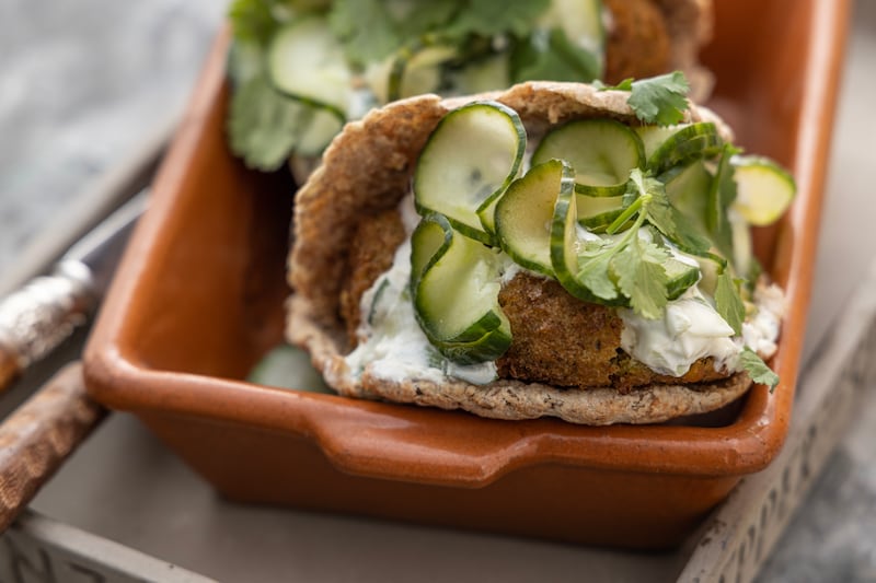 Falafel pitta sandwiches, tzatziki and pickled cucumbers. Photogtaph: Harry Weir