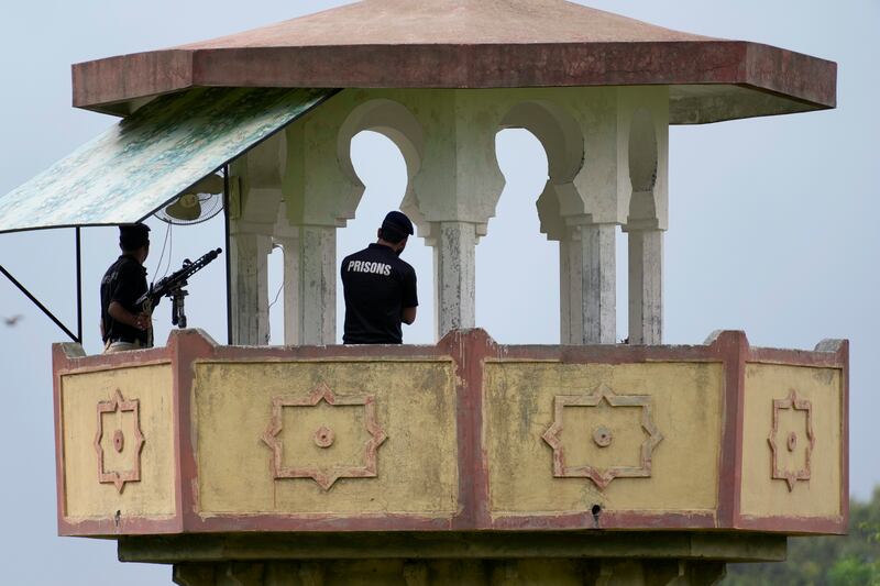 Police stand guard on a watch tower at Attock prison, where Imran Khan is now among the inmates. Photograph: Anjum Naveed/AP