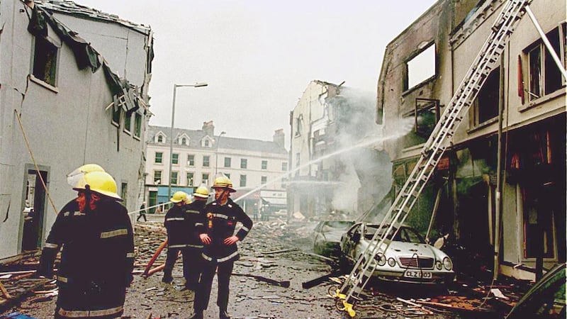 Firefighters at work after  a car bomb exploded in Portadown near a police station. Photograph:  AFP via Getty Images