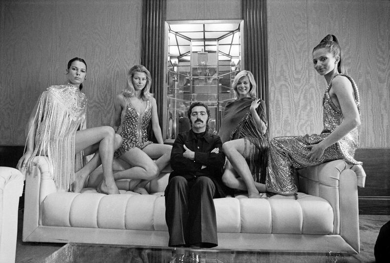 Paco Rabanne in 1970, posing with models in his dresses. Photograph: Jack Manning/The New York Times