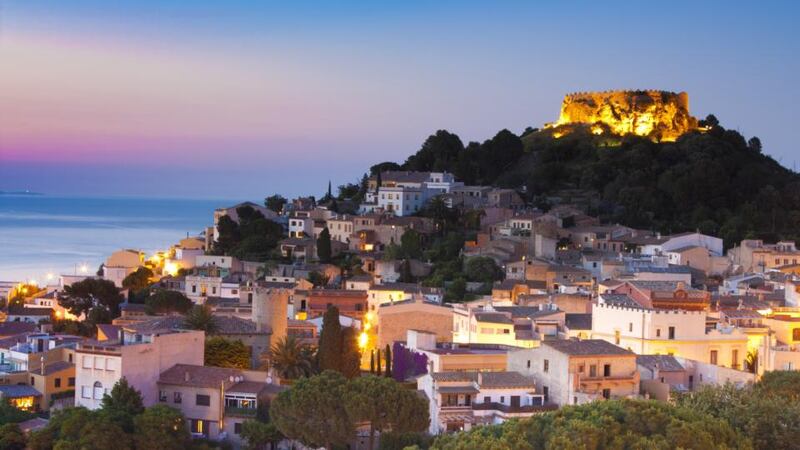 Begur village and castle at dusk