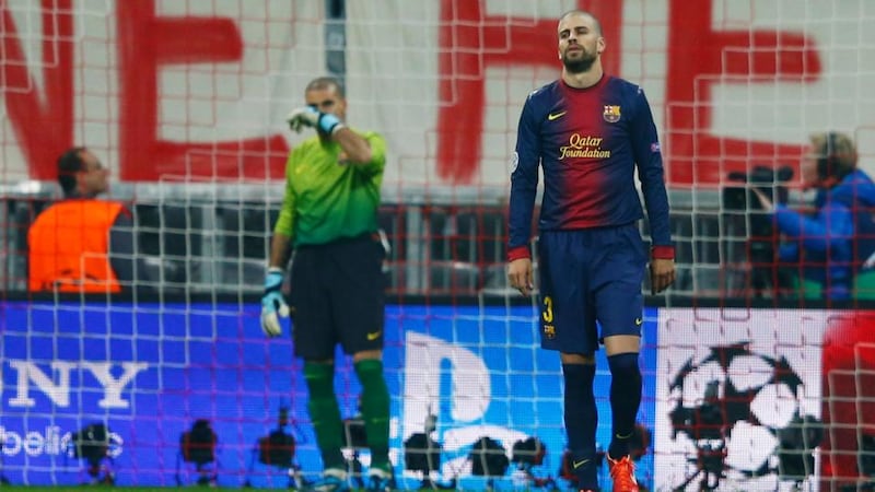 Barcelona’s Gerard Pique (right) and goalkeeper Victor Valdes react after Bayern Munich’s Mario Gomez (not pictured) scored the second at Arena Stadium in Munich. Photograph: Michael Dalder/Reuters