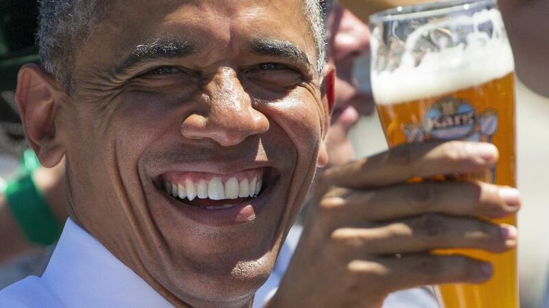 US President Barack Obama takes part in a toast as he visits Kruen in  southern Germany ahead of a  Group of Seven (G7) summit. Photograph: Hannibal Hanschke/Reuters.