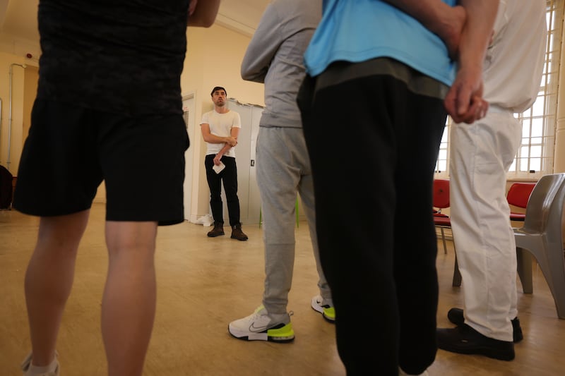 Ronan Conway working with prisoners at Castlerea Prison. 'When one person speaks, or five people speak, the room almost supports that vulnerability.' Photograph: Alan Betson