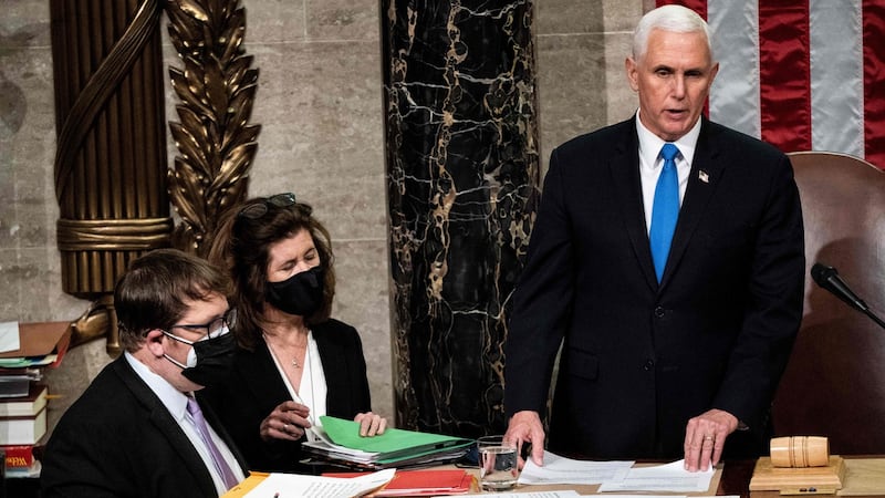 Mike Pence presides over a joint session of Congress to certify the 2020 electoral college results after supporters of President Donald Trump stormed the US Capitol earlier in the day. Photograph:   Erin Schaff/POOL/AFP via Getty Images