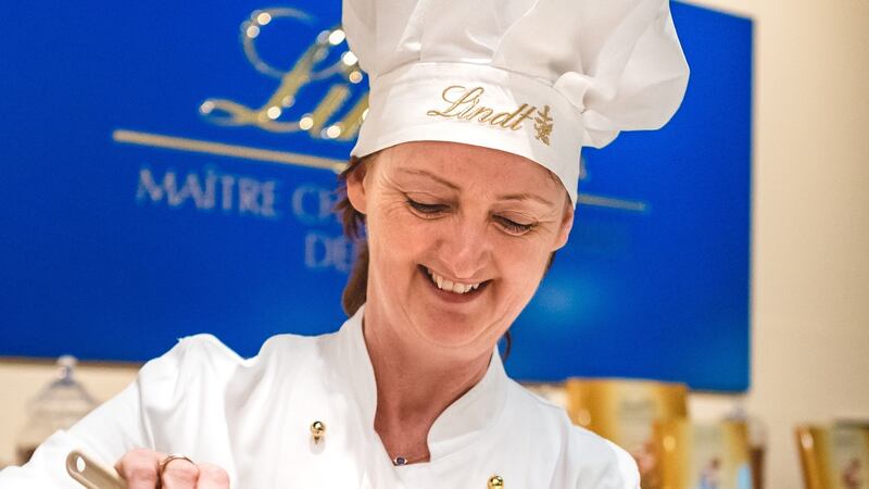 Marie-Claire Digby having a go at  making chocolate bars at the Lindt factory in Kilchberg, near Zurich. Photograph: Ondrej Kolacek