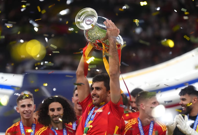 Spain's Rodri celebrating with the trophy after winning the Uefa Euro 2024 Final. Photograph: Adam Davy/PA