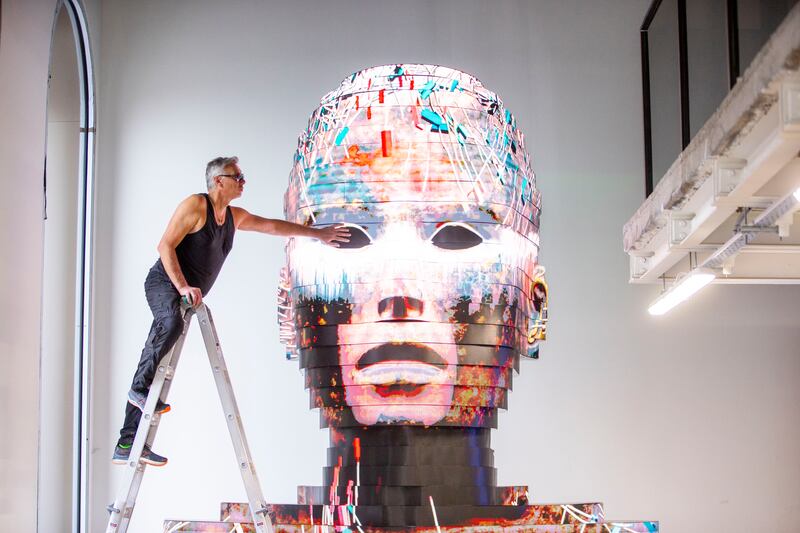 Patrick Dunning, creator of the Giant Experience, puts the final touches to an exhibit at Central Plaza, Temple Bar, in Dublin. The exhibition, which turns digital scanning into theatre, opens on Wednesday. Photograph: Tom Honan