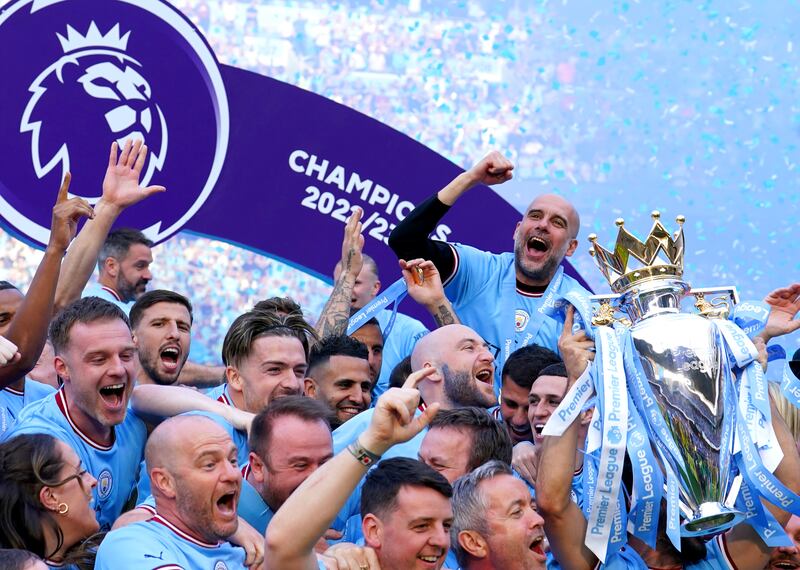 Manchester City manager Pep Guardiola celebrates with his team after lifting the Premier League trophy in June. Photograph: Martin Rickett/PA Wire