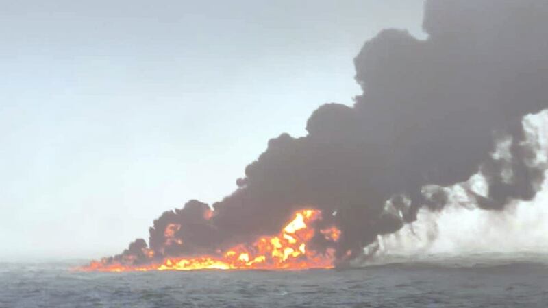 Black smoke billows into the air after a crash between an oil tanker and a cargo ship. Photograph: Bartek Smialek/PA Wire 