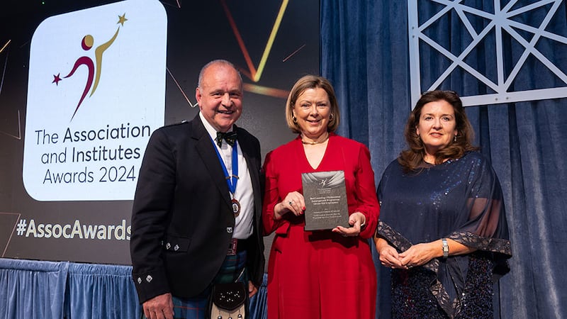 Steve Mungavin, awards judge, presents the best learning / professional development programme (100+ employees) awards to Claire O'Mahony and Hazel Bradley, Law Society of Ireland