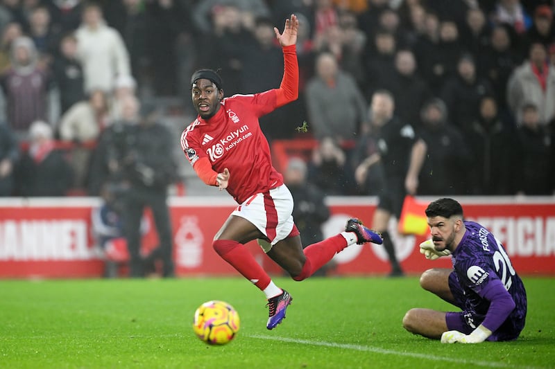 Anthony Elanga of Nottingham Forest scores his team's first goal past Fraser Forster of Tottenham Hotspur. Photograph: Clive Mason/Getty