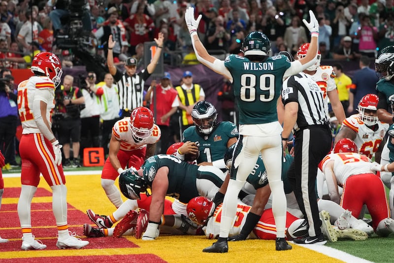 Philadelphia Eagles quarterback Jalen Hurts rushes for a touchdown as Eagles wide receiver Johnny Wilson celebrates. Photograph: Timothy A. Clary/AFP          