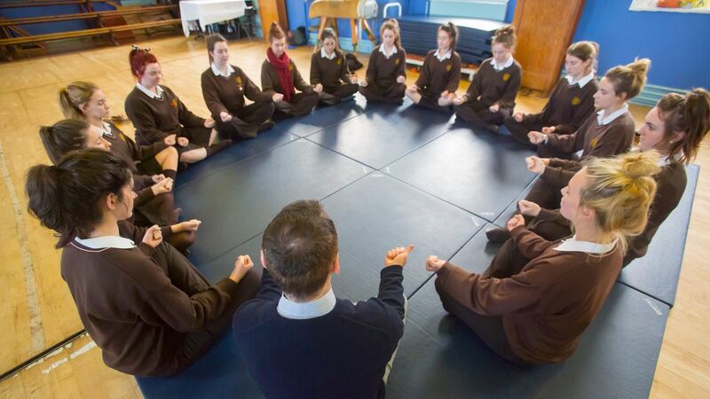 Sixth-year students at Loreto Secondary School, Wexford town, do breathing and stress relief exercises with psychologist  Peadar Maxwell. Photograph: Patrick Browne