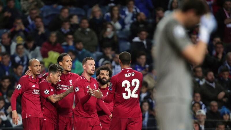 Liverpool’s Virgil van Dij celebrates  after scoring against  Porto.