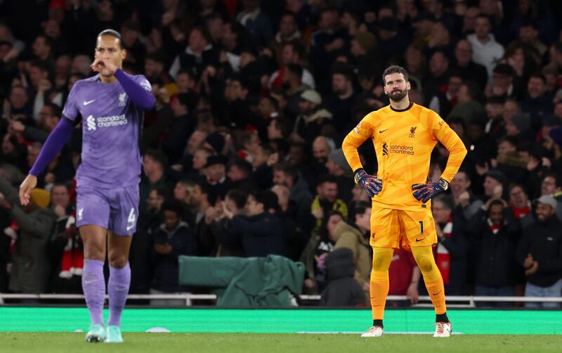 Liverpool goalkeeper Alisson and team-mate Virgil van Dijk react after Arsenal scored their second goal. Photograph: Andy Rain/EPA