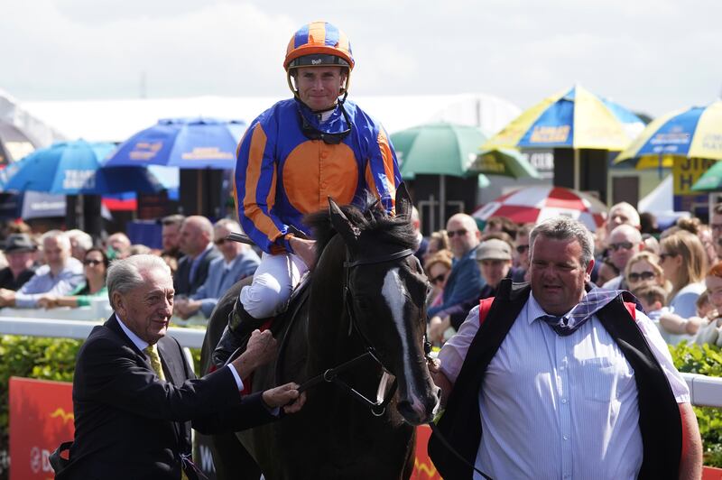 Auguste Rodin and Ryan Moore after winning the Dubai Duty Free Irish Derby during day three of the festival at the Curragh. Photograph: Brian Lawless/PA.

