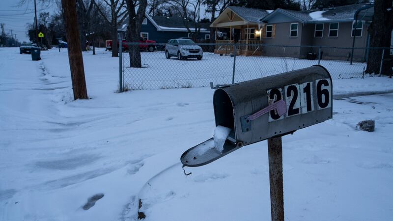 A mailbox is seen frozen in a snow-covered neighbourhood in Waco, Texas. Photo: Matthew Busch / AFP via Getty Images