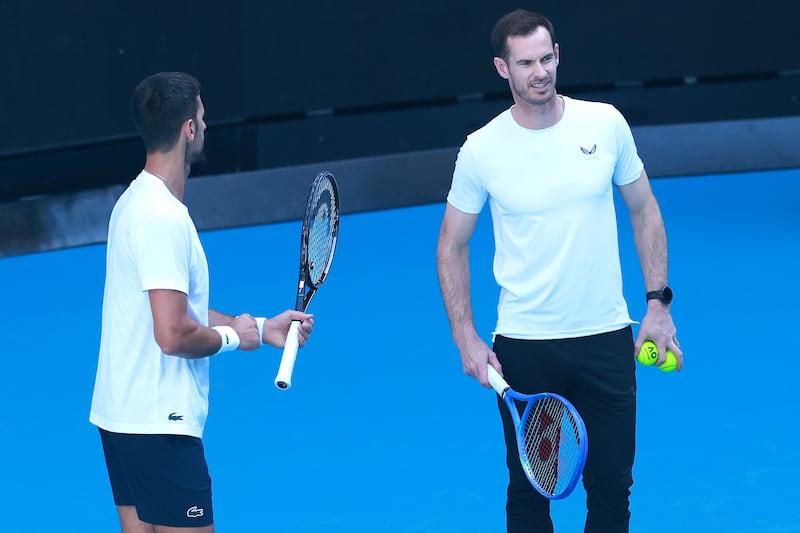 Novak Djokovic of Serbia speaks to coach Andy Murray during a practice session. Photograph: Kelly Defina/Getty