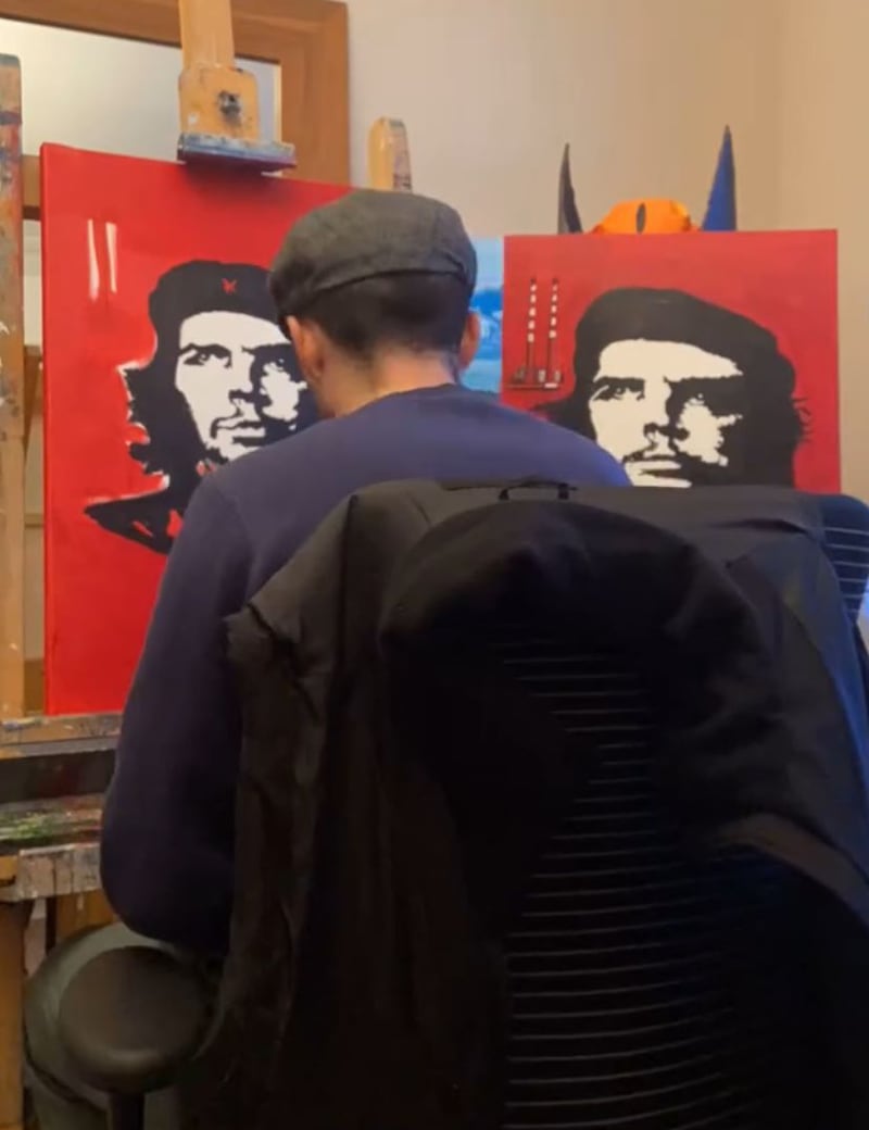 Barry Heneghan painting Ché Guevara with the Ringsend chimneys in the background