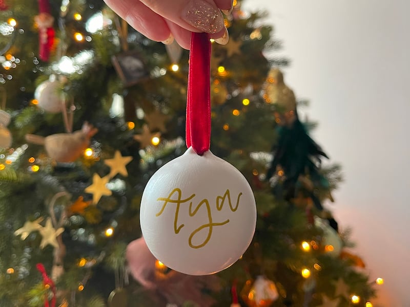 A Chupi Sweetman Christmas decoration with her daughter's name, from chupi.com