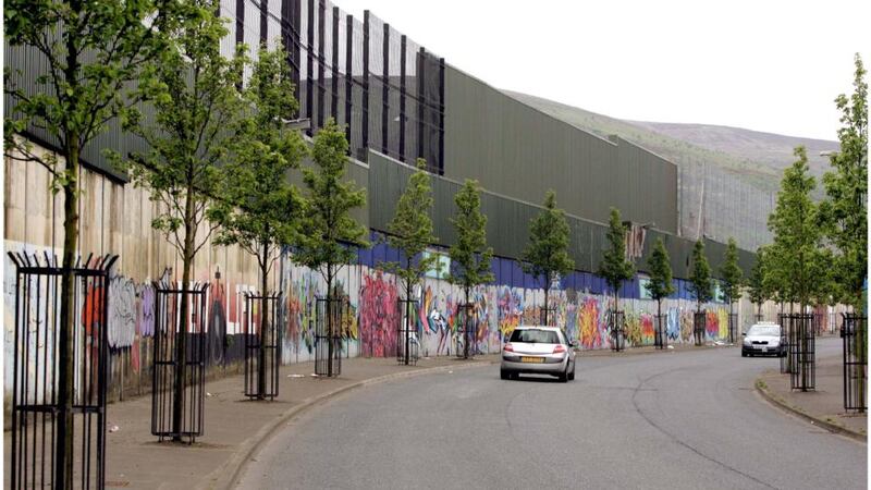 A peace wall on Cupar Street off Shankill Road in Belfast. All peace walls are to be eliminated by 2023 under the new plan.