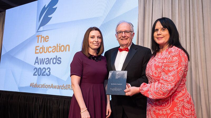 Dr Matt Cotterell, awards judge, presents the Best Masters Programme award to Prof. Joanne Lysaght and Prof. Jacintha O'Sullivan, Trinity College Dublin 