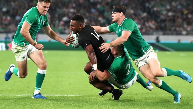 New Zealand’s Sevu Reece  is tackled by Jordan Larmour and  Garry Ringrose during the  Rugby World Cup quarter-final at the Tokyo Stadium. Photograph: Cameron Spencer/Getty Images