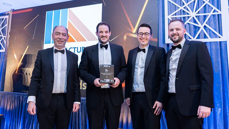 Denis Dowling, full professor, School of Mechanical and Materials Engineering, University College of Dublin presents the manufacturer of the year – medium business award to the Denroy team