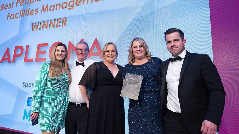 Cliona Molloy, managing director at McKeon Group, presents the Best People Development in Facilities Management award to Apleona HSG Ireland team.