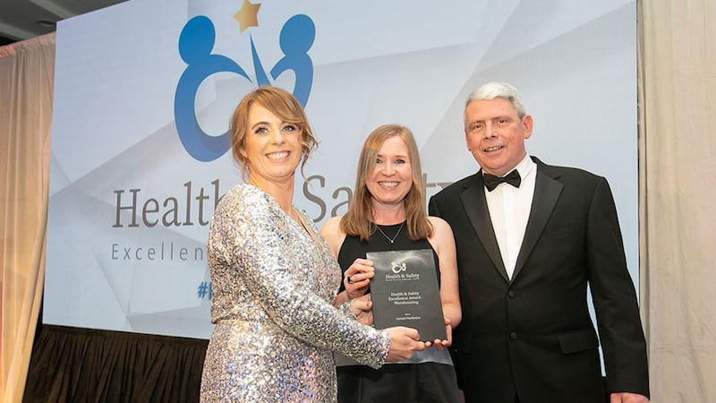 Ann Marie McLoughlin, awards judge, presents the Health & Safety Excellence Award - Warehousing to Maya Gough and Danny McGurran, United Hardware