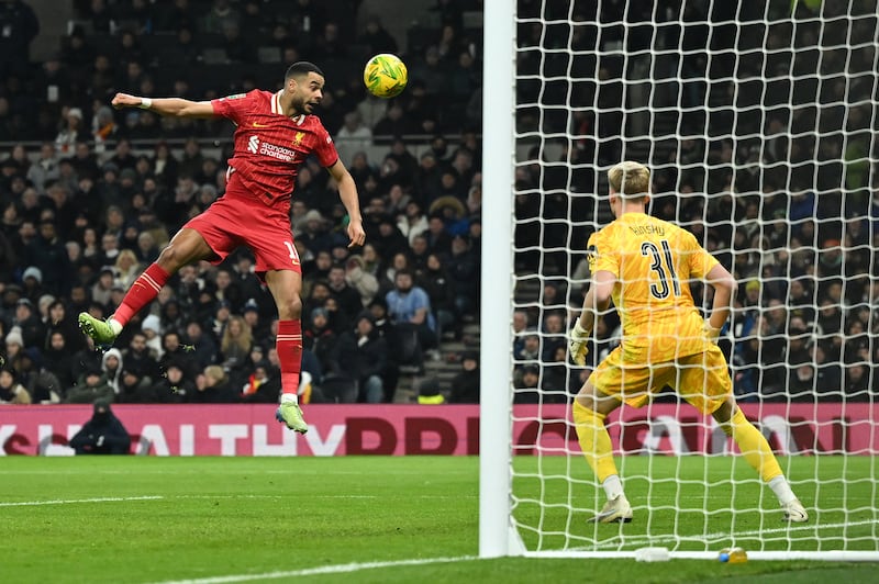 Tottenham Hotspur goalkeeper Antonin Kinsky watches as Liverpool's Cody Gakpo heads the ball wide. Photograph: Justin Tallis/AFP via Getty Images