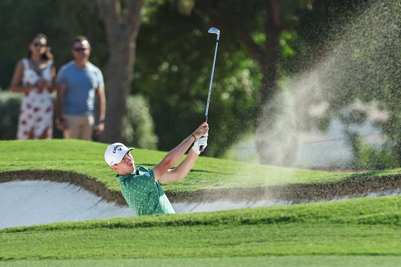 Northern Ireland's Tom McKibbin plays a shot from a bunker on the 18th hole during the DP World Tour Championship golf tournament. Photograph: Fadel Senna/AFP via Getty Images