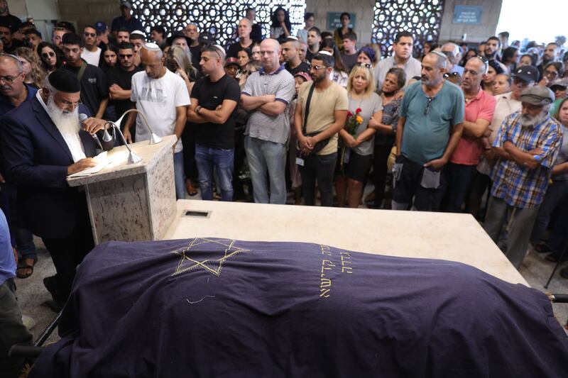 Relatives of 22-year-old Israeli-Irish woman Kim Damti mourn during her funeral. Photograph: EPA/Abir Sultan