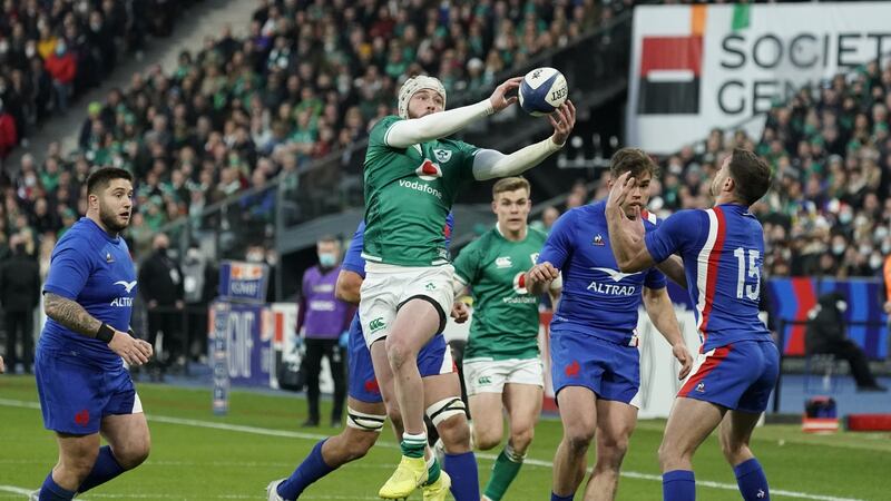 Mack Hansen chases the ball down before going on to score Ireland’s  first try against France at the Stade de France. Photograph: Dave Winter/Inpho