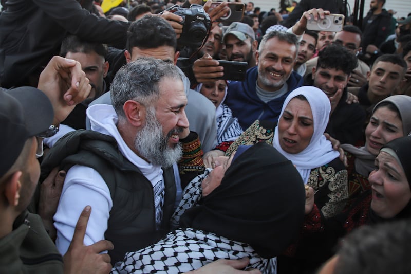 Freed Palestinian prisoners are greeted by relatives. Photograph: AP