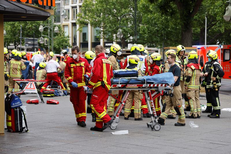 Emergency services move a stretcher at the site where a car drove into a crowd in Berlin, on Wednesday. Photograph: Odd Andersen/AFP via Getty Images