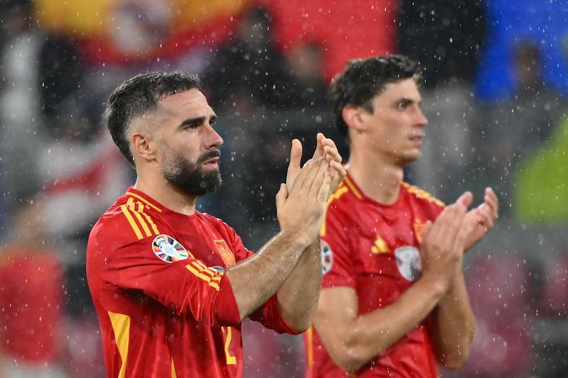 Spain's Dani Carvajal (left) and Robin Le Normand applaud fans after the win over Georgia at Euro 2024. Photograph: Alberto Pizzoli/AFP via Getty Images