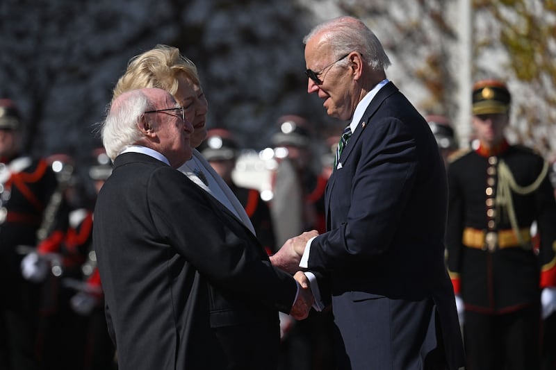 US president Joe Biden (right) is welcomed by President Michael D Higgins and his wife Sabina outside Áras an Uachtaráin in Dublin on April 13th. Photograph: Jim Watson/AFP via Getty